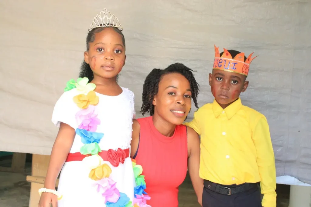 A girl and a boy with their mother